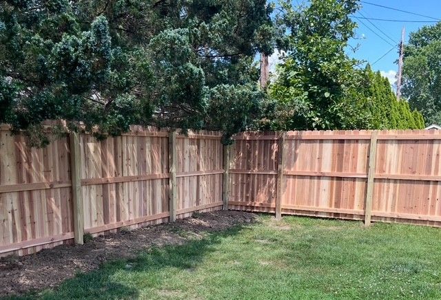 Wood privacy fence installation in backyard – natural cedar fencing for durability, security, and curb appeal in St. Louis MO.
