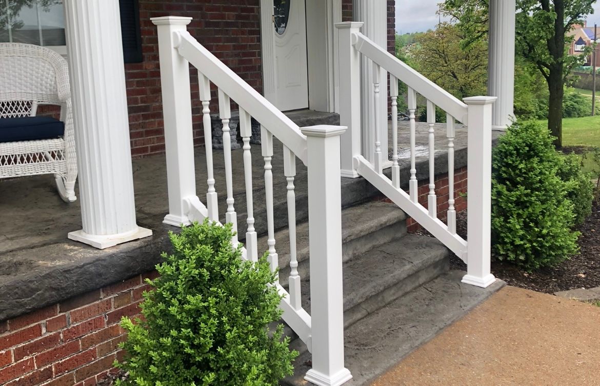 White vinyl stair handrail installation with decorative posts – durable and weather-resistant railing in Missouri.