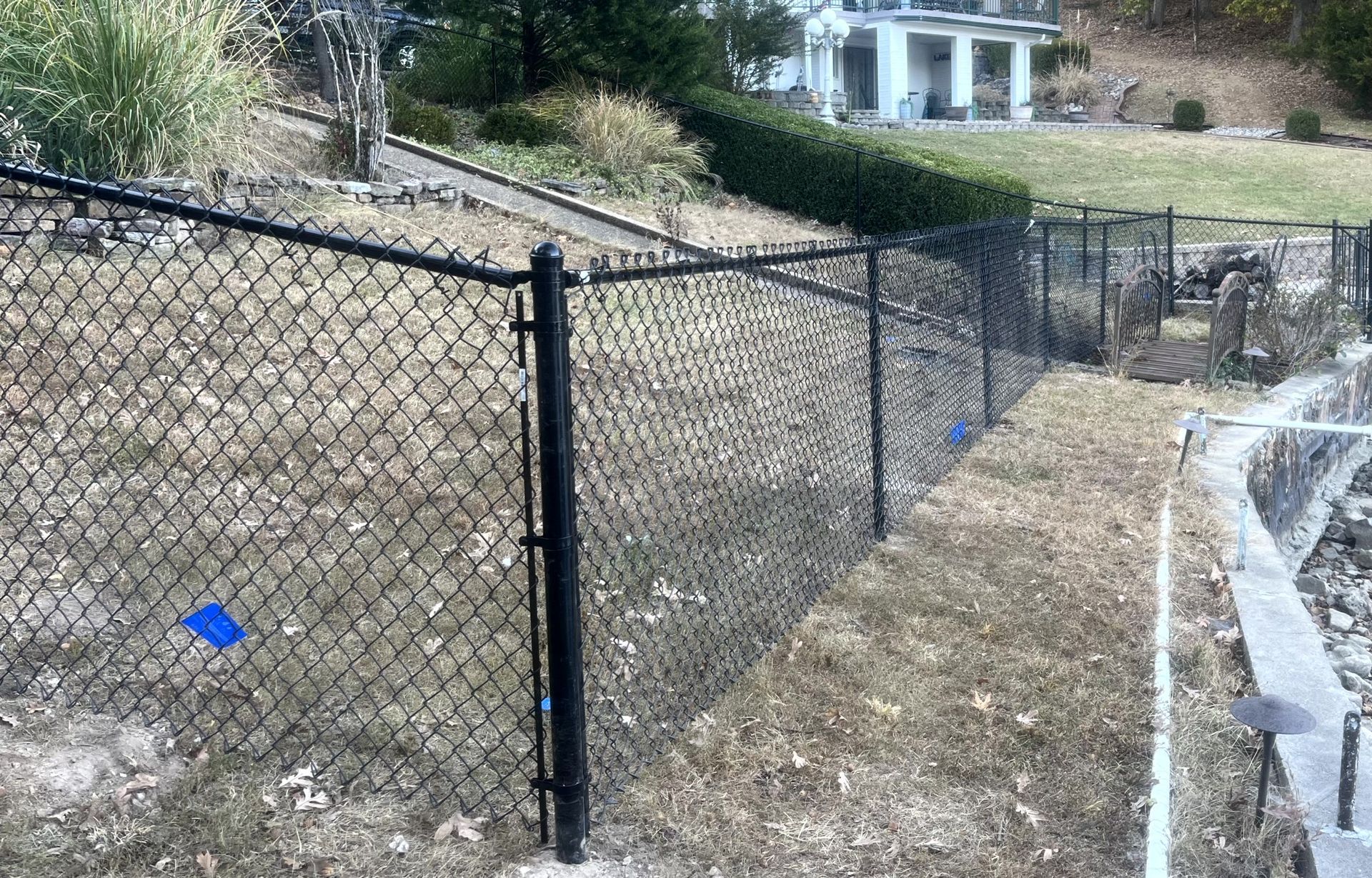 Black chain link fence used for yard security and property boundaries in Arnold, MO