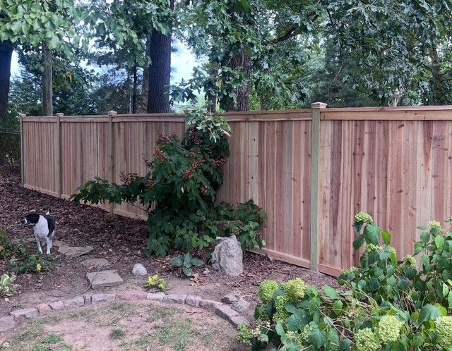 Custom Cedar wood privacy fence installation in backyard – natural wood fencing for security, durability, and curb appeal in St. Louis MO.