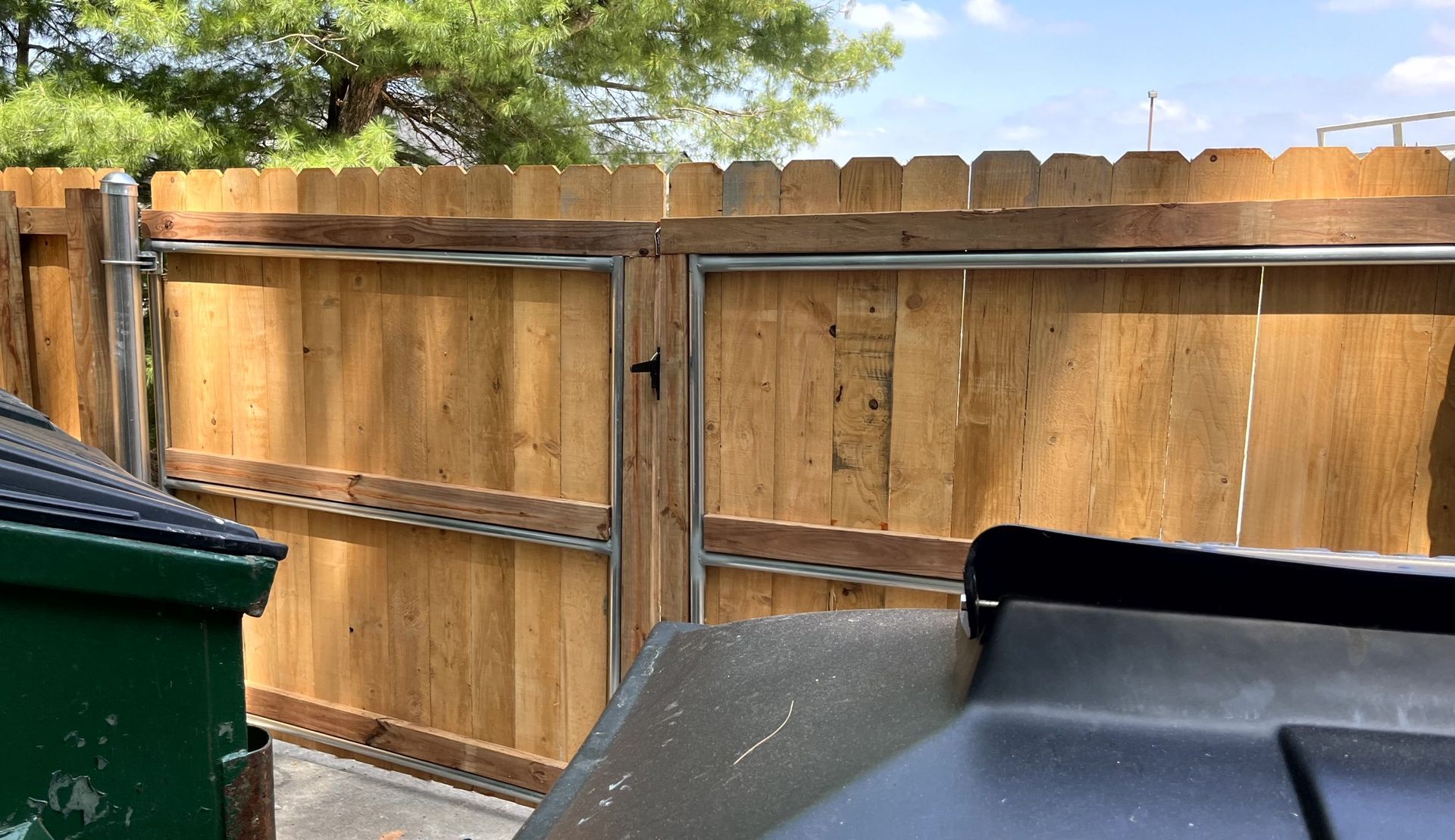Interior view of wood dumpster enclosure designed for commercial trash storage