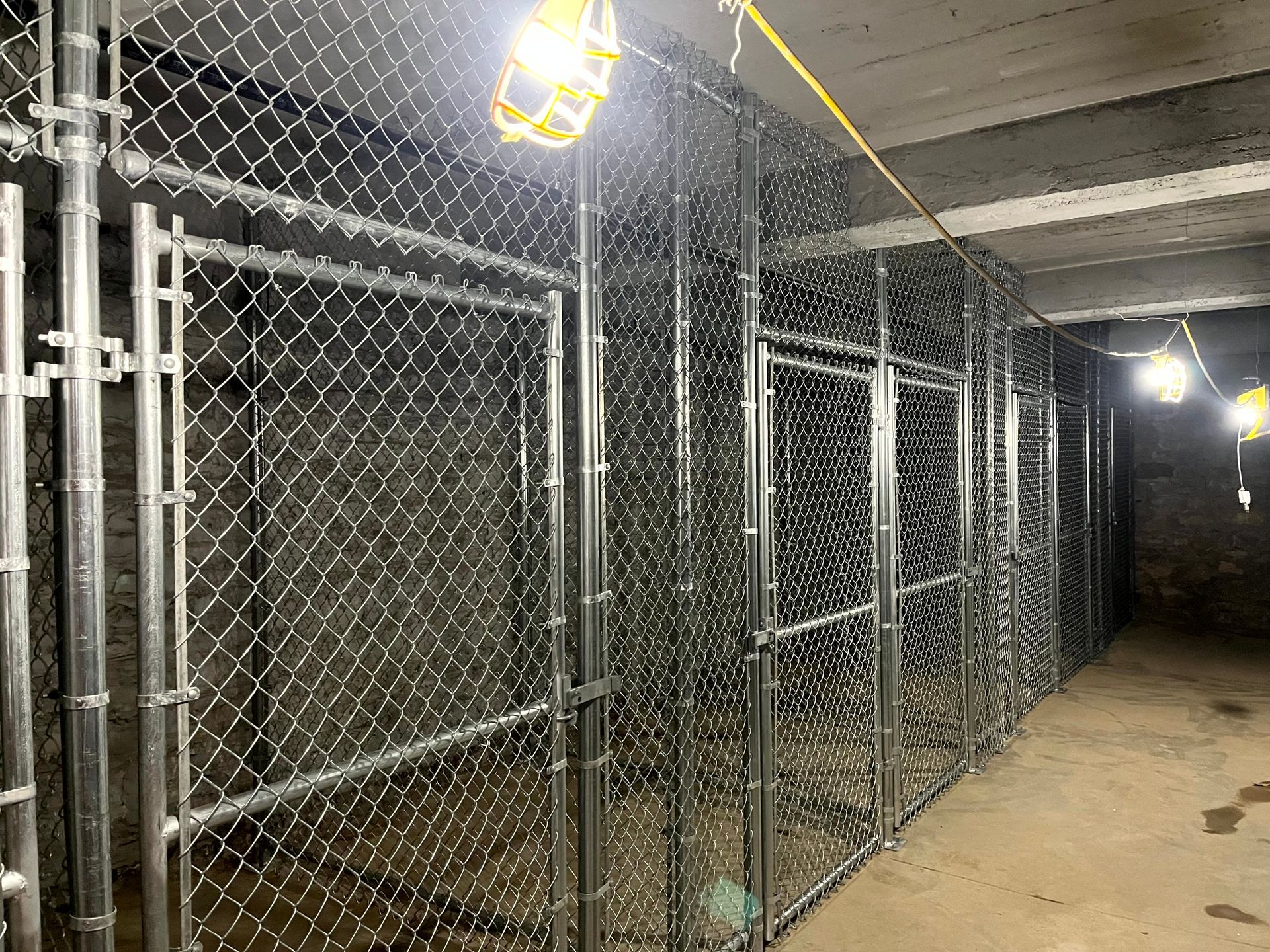 Indoor chain link storage cages installed by Makic Fence and Deck