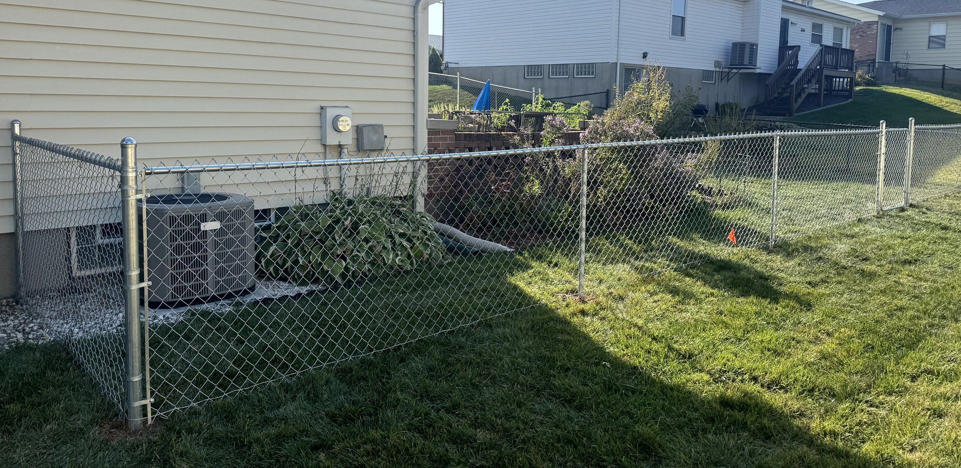 Chain link fence installation in Oakville, MO by Makic Fence & Deck