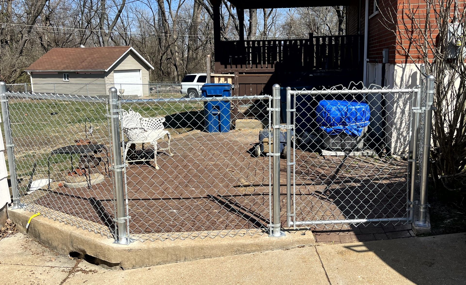 Residential chain link fence installation by Makic Fence & Deck serving homeowners in the St. Louis region