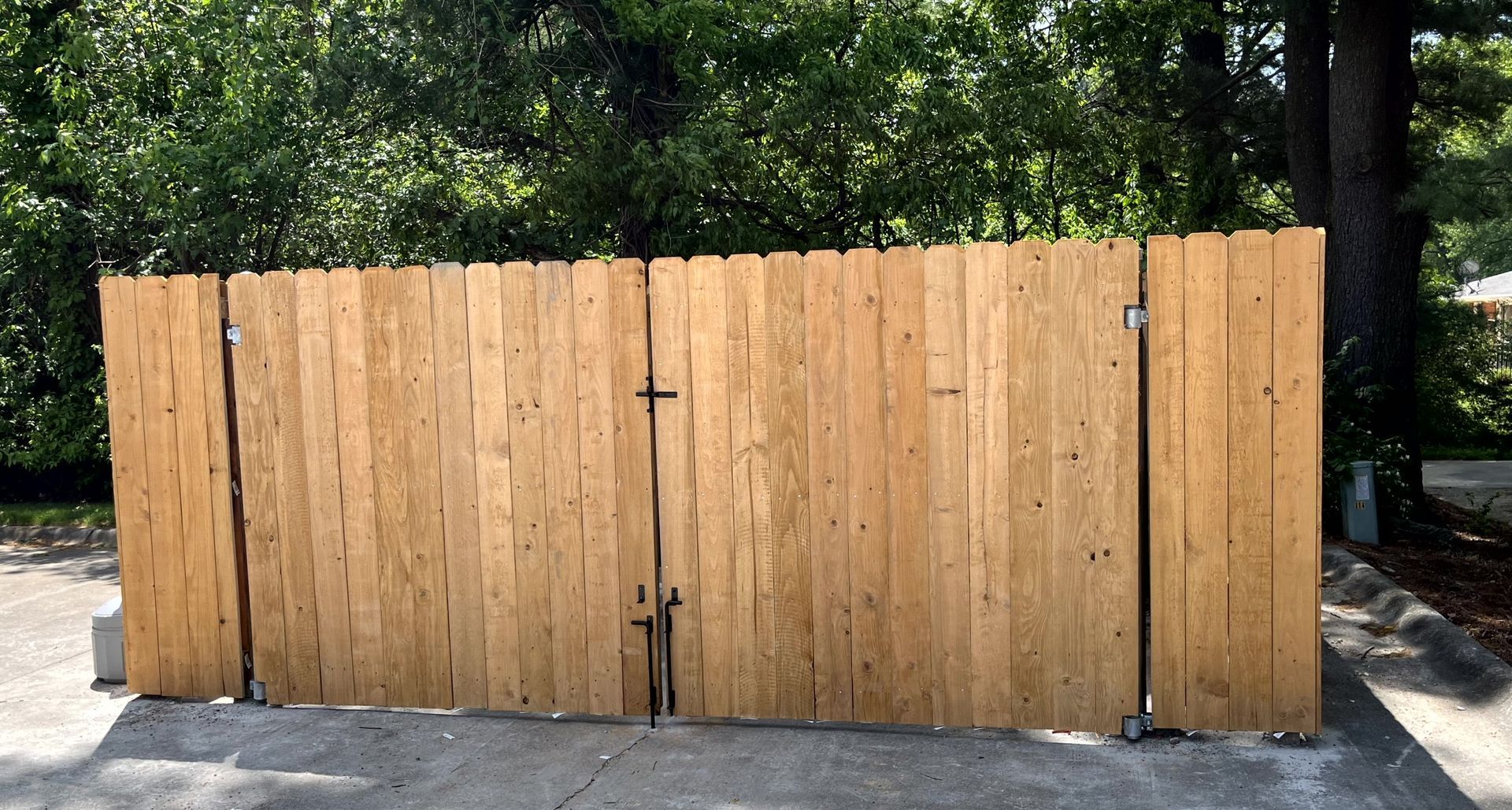 Wood dumpster enclosure providing privacy and screening for commercial property