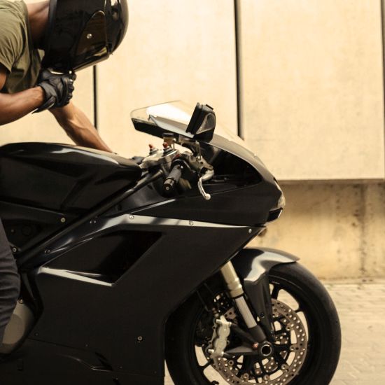 man on motorcycle preparing for a ride