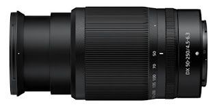 A close up of a camera lens on a white background.