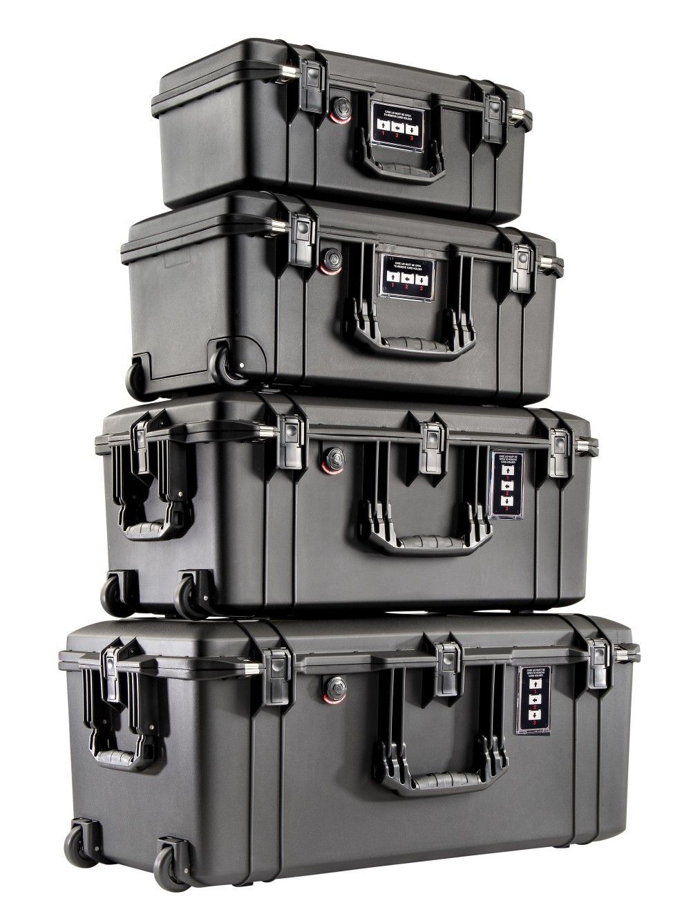 several hard case camera bags stacked on top of each other, arranged on a white background