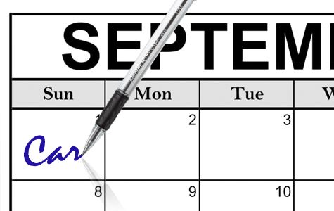 A pen is writing the word car in the first box of a calendar for the month of September.