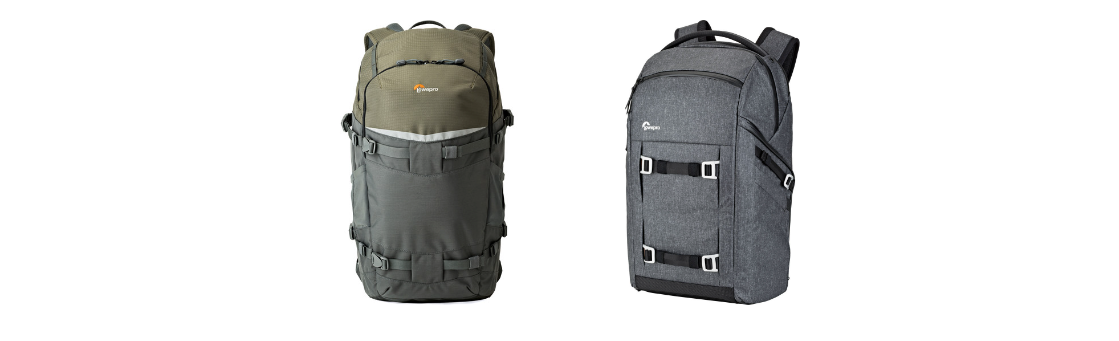 Two camera backpacks are sitting next to each other on a white background.