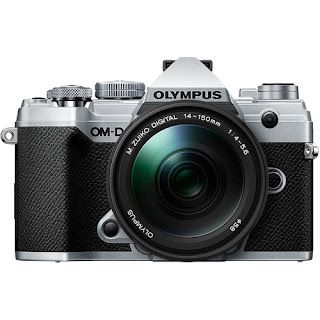 The olympus om d e m5 mark ii is a camera with a large lens.