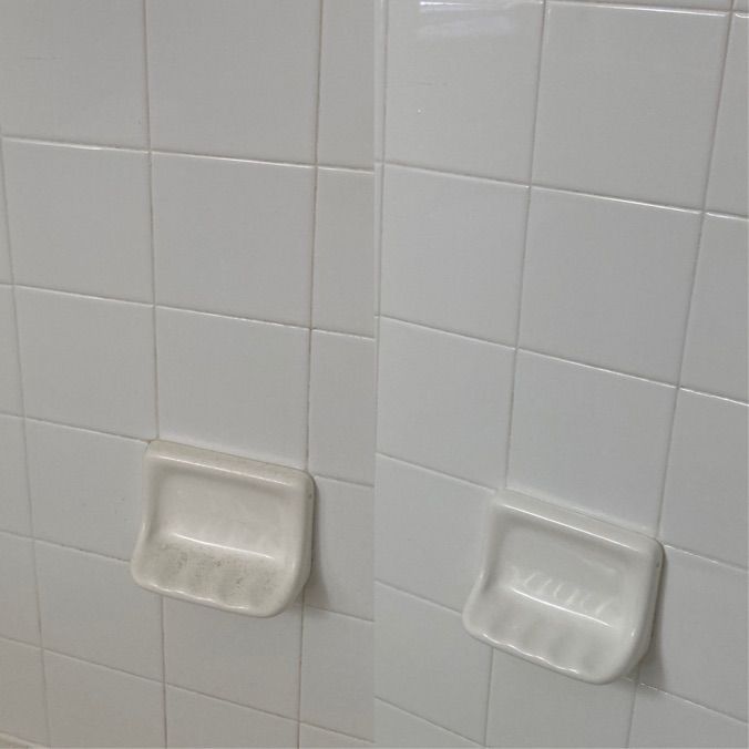 Two side-by-side photos of a white tile wall with a soap dish; the left is before cleaning and the right is after cleaning.