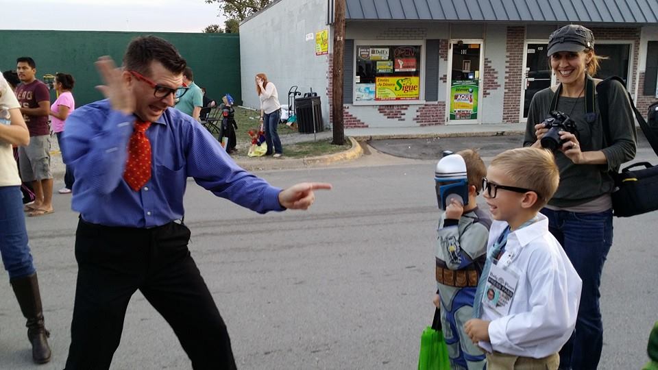 man with costume and the two kids