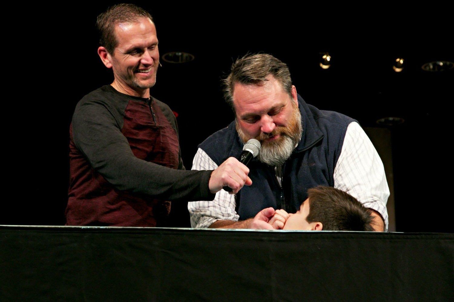 bearded man doing baptism