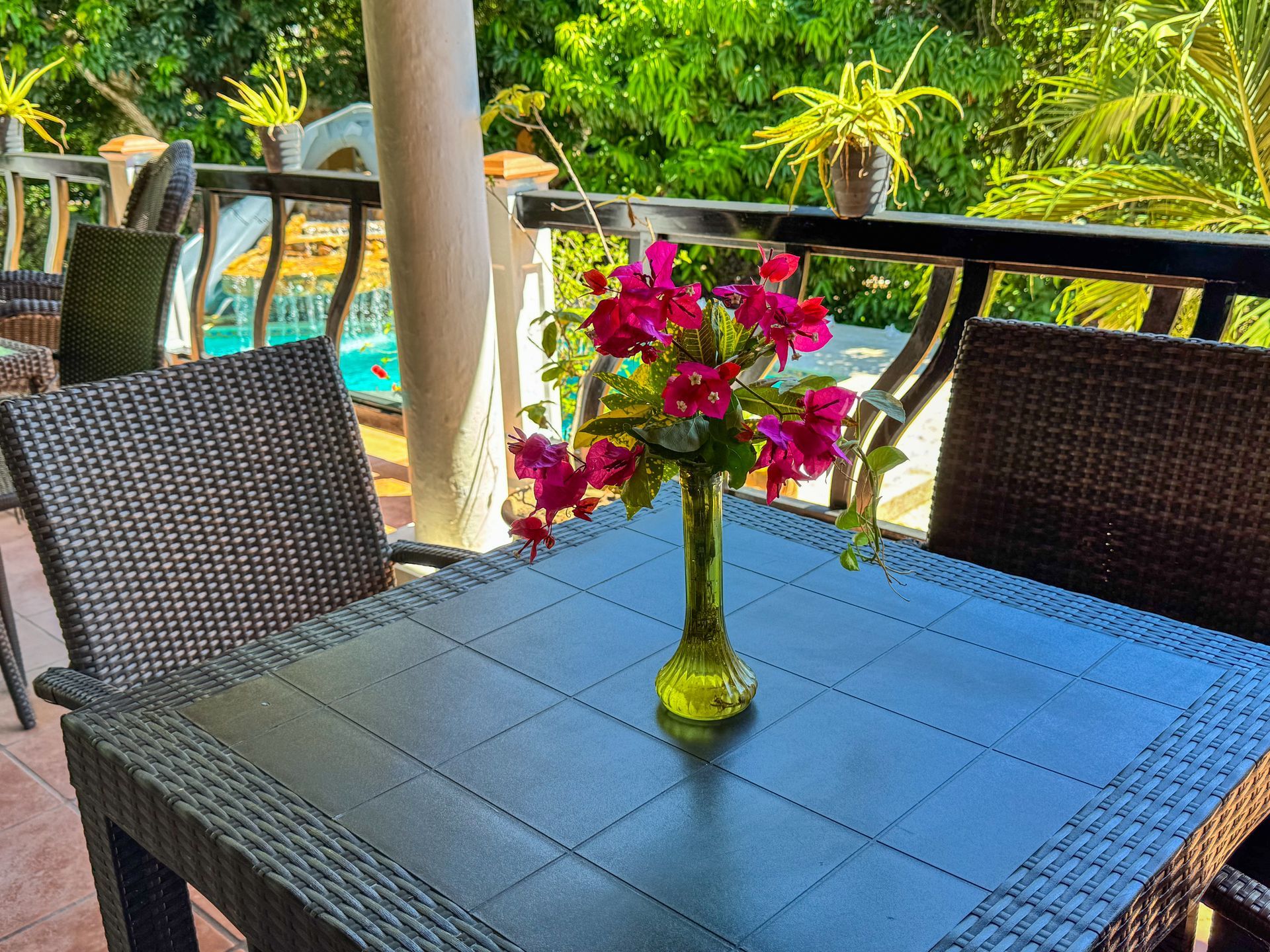 A table with a vase of flowers on it