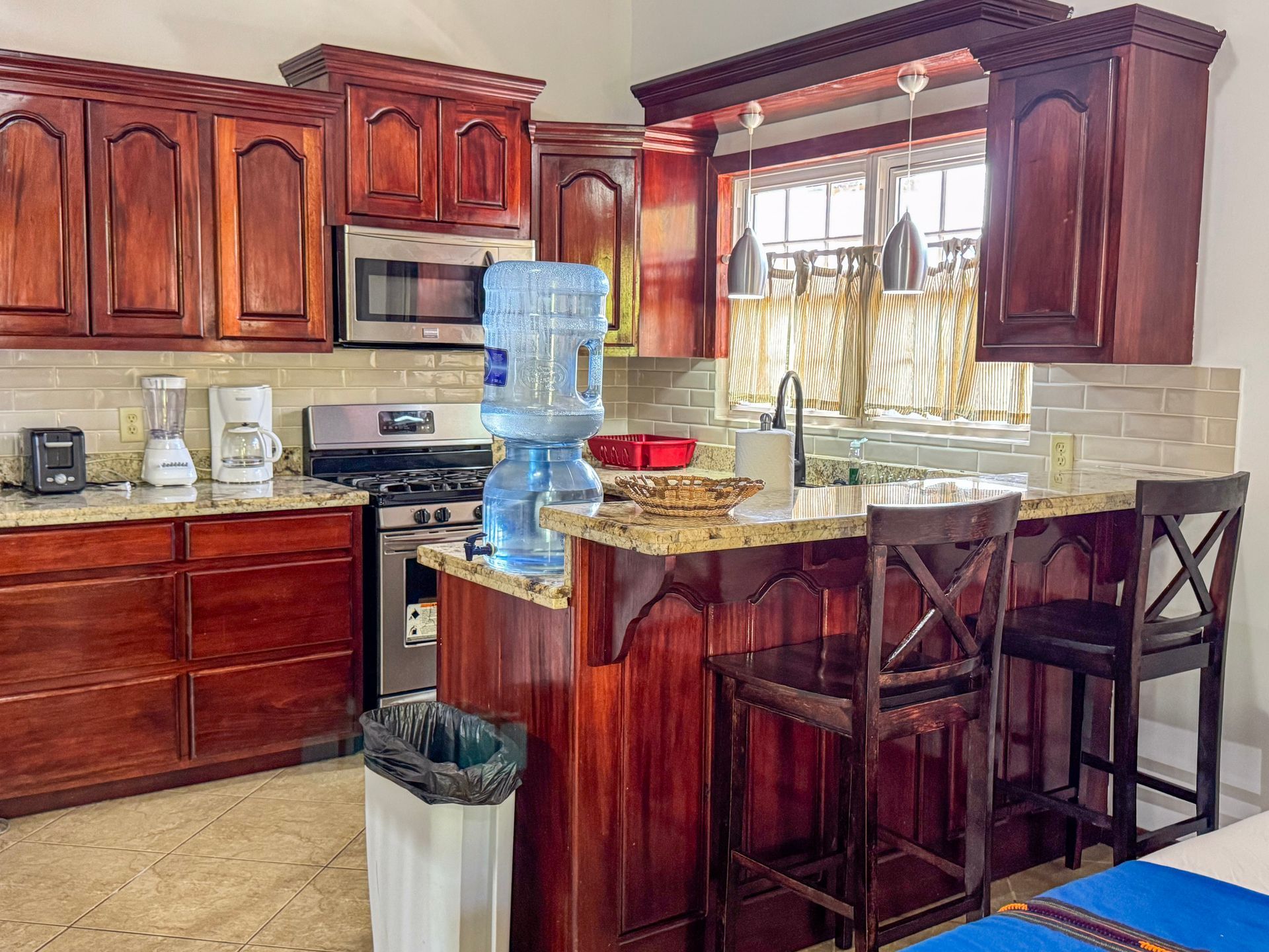 A kitchen with wooden cabinets , granite counter tops ,apartment with kitchen in Hopkins Village