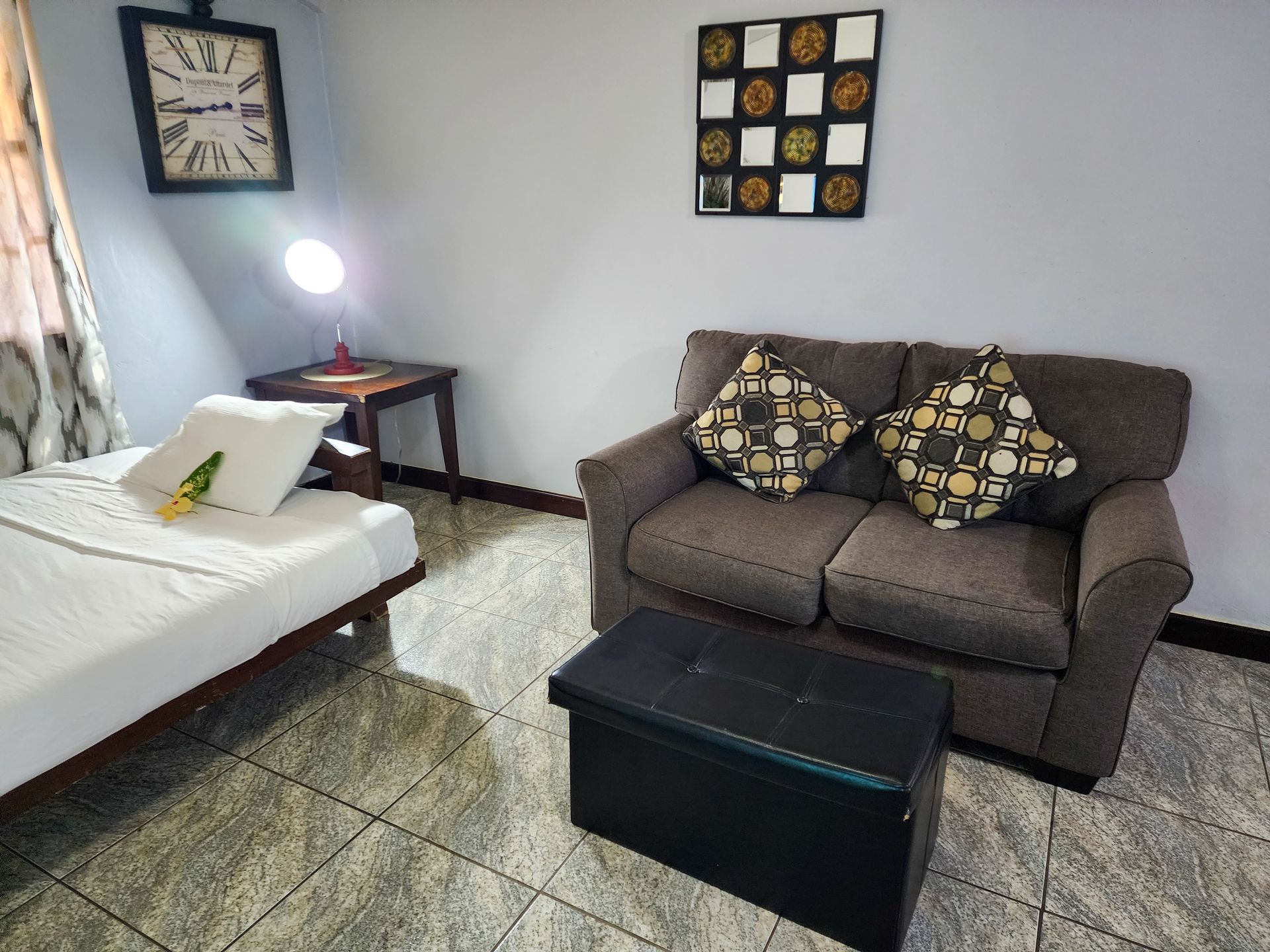 comfortable living area and futon bed, accommodations at Caribbean Shores B&B, Hopkins Village