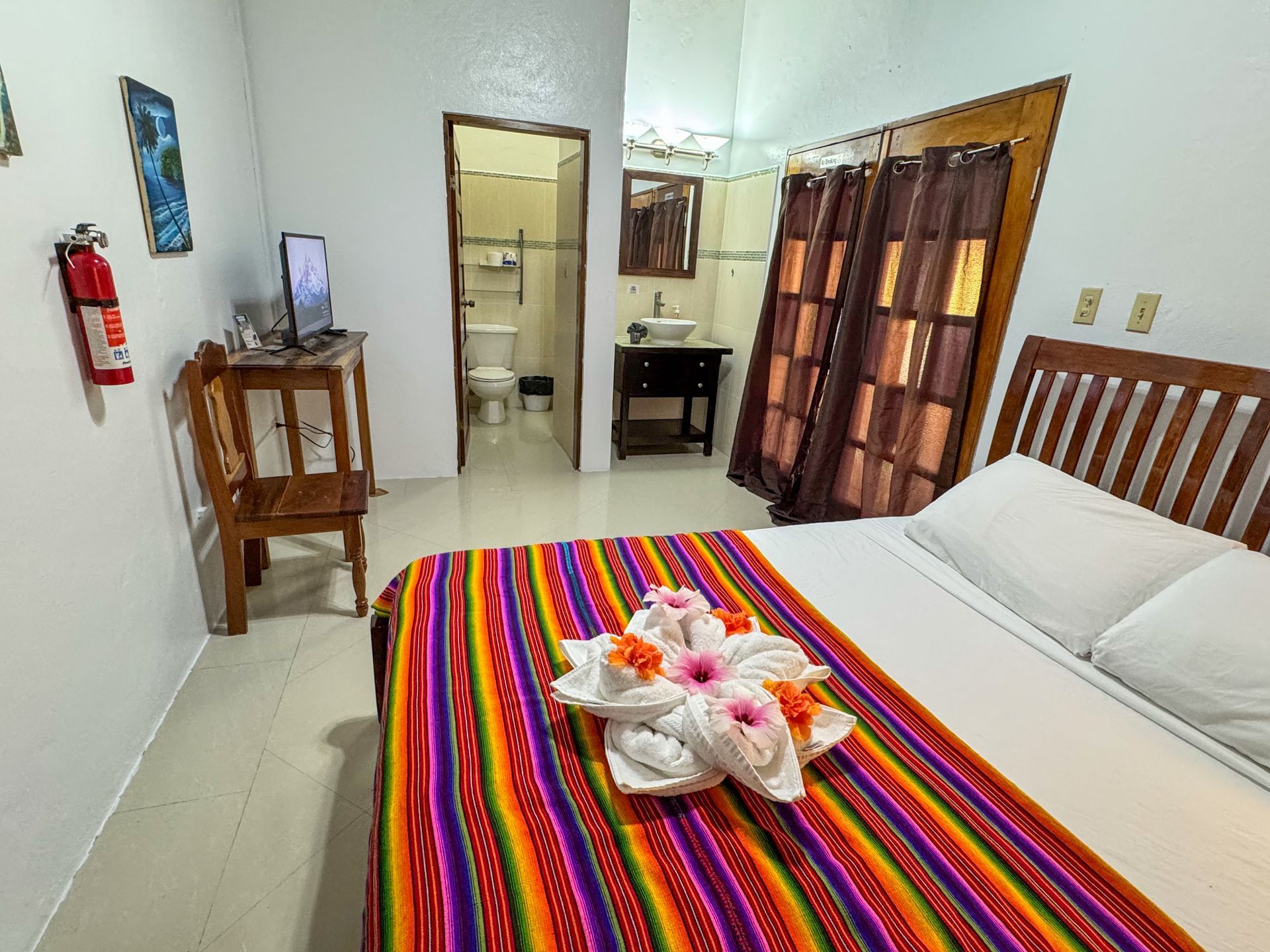 Comfortable queen bedroom with modern Belizean design at Caribbean Shores B&B, Hopkins Village