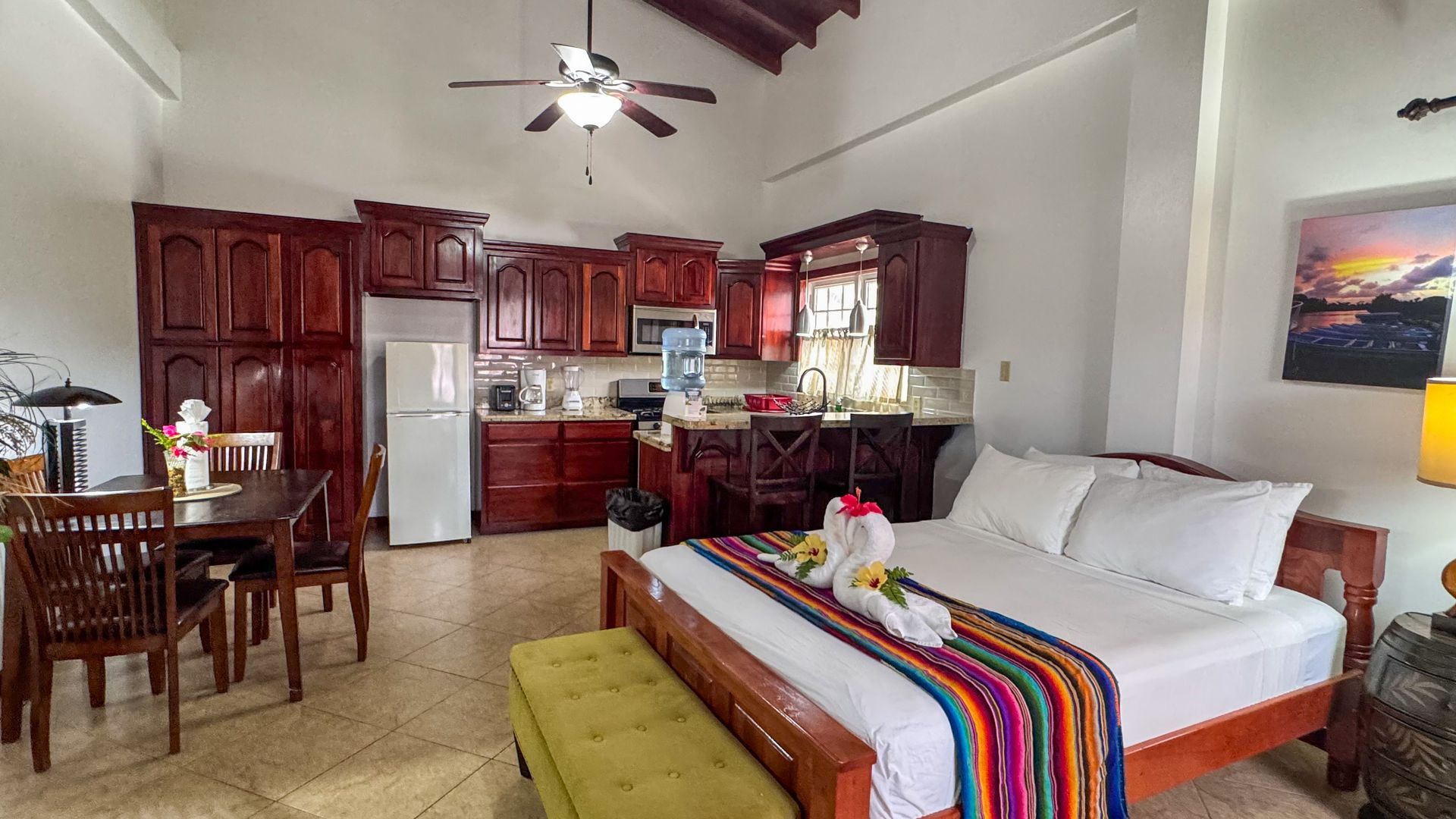 Bright and airy guest room at Caribbean Shores B&B featuring modern amenities and Belizean charm.