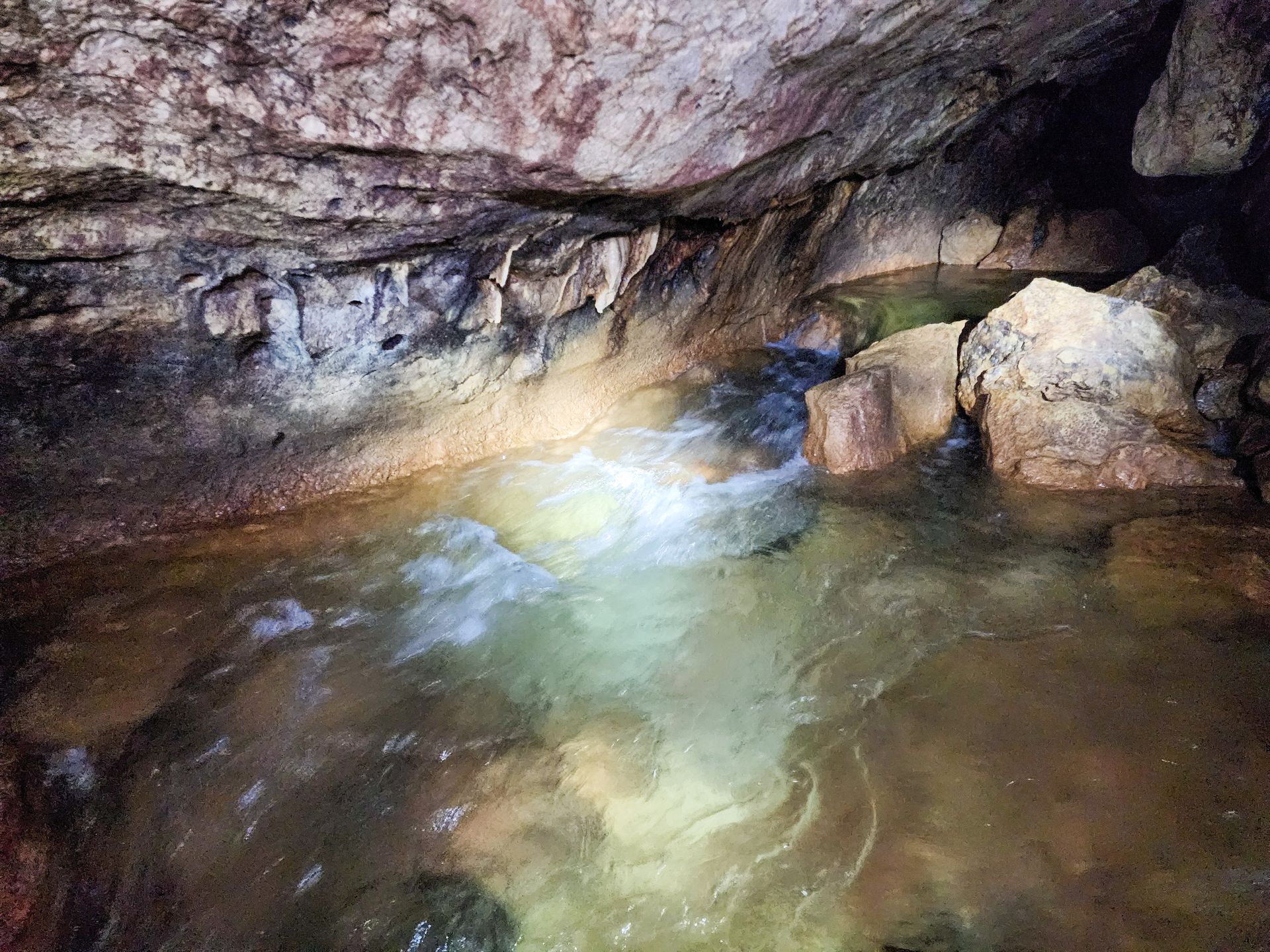 St Herman's Cave Tubing tour departing from Hopkins Village