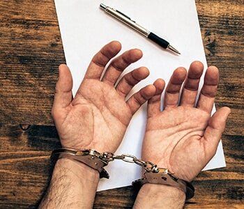 Bail Bonds - Handcuffs with Paper and Pen in Houston, TX