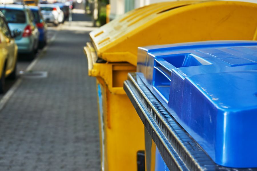 Blue and Yellow Dumpsters