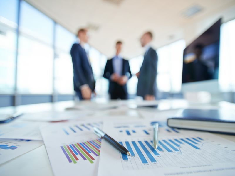 Reports and Data on Table and Men Discussing