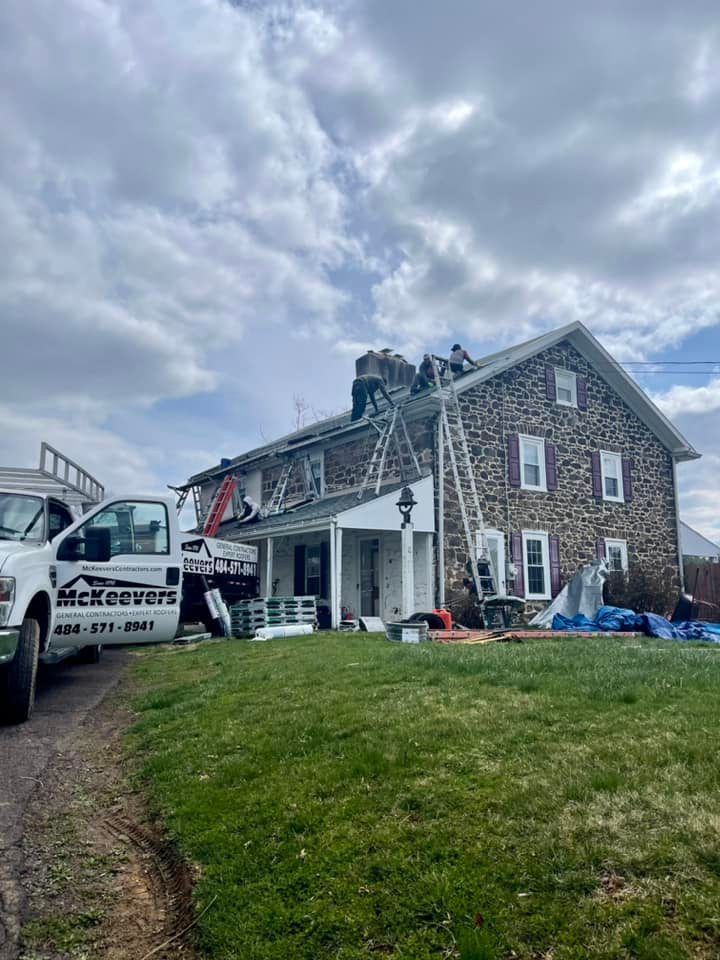Men at work removing old roofing - Plymouth Meeting, PA - McKeever's General Contractors