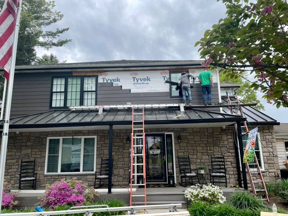 Men at work adding new siding - Plymouth Meeting, PA - McKeever's General Contractors