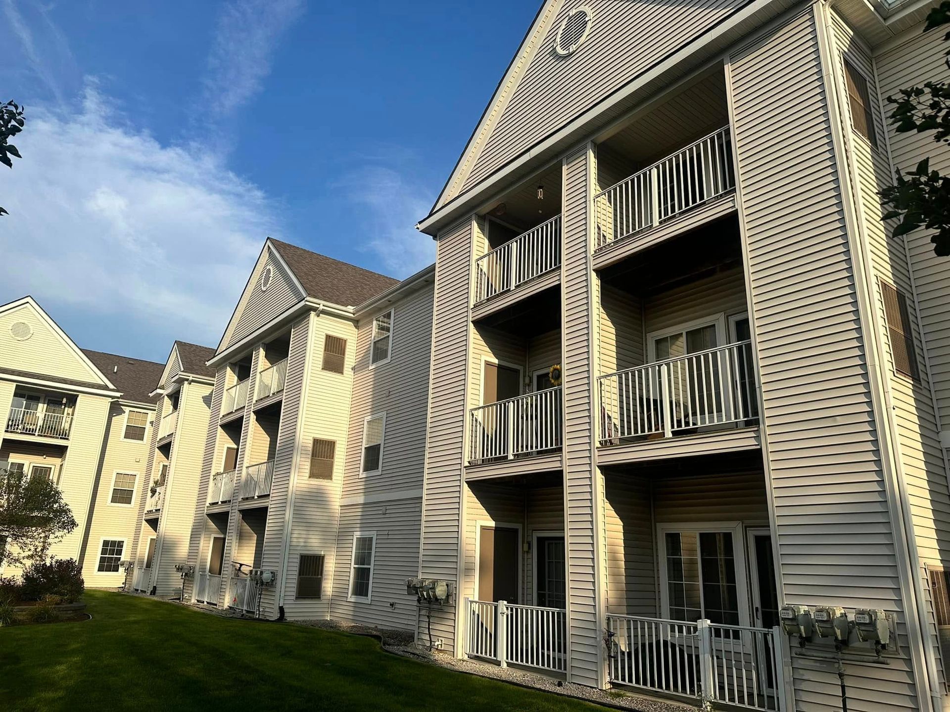 A large apartment building with a lot of windows and balconies