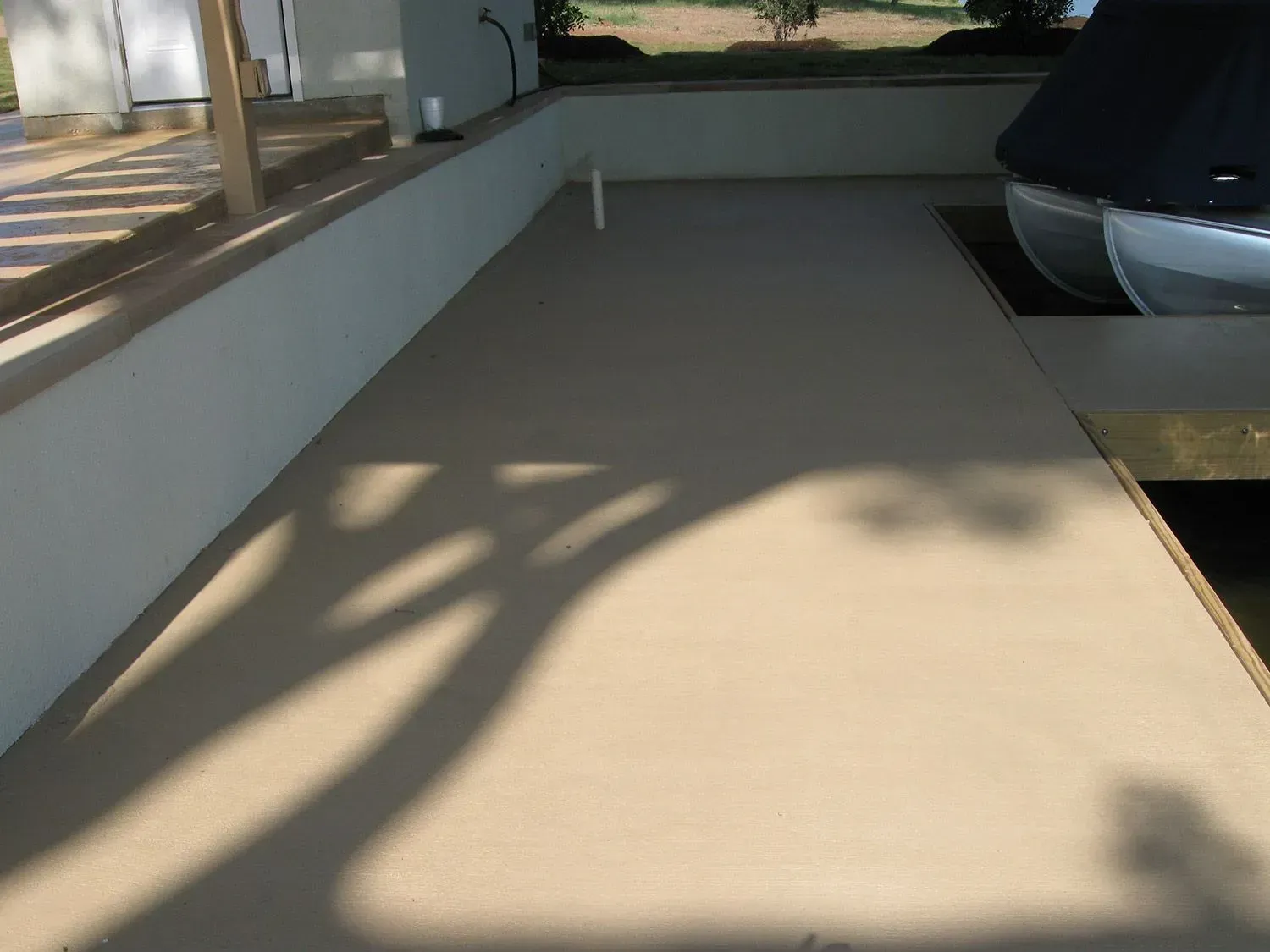 A shadow of a boat is cast on the floor