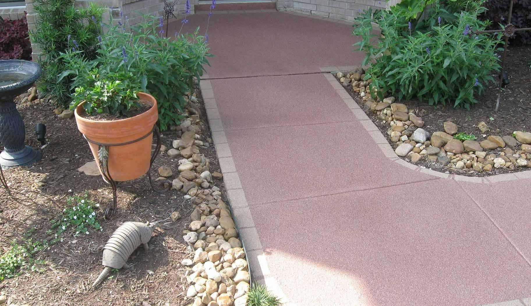 A garage with a shiny floor and a bicycle hanging on the wall.