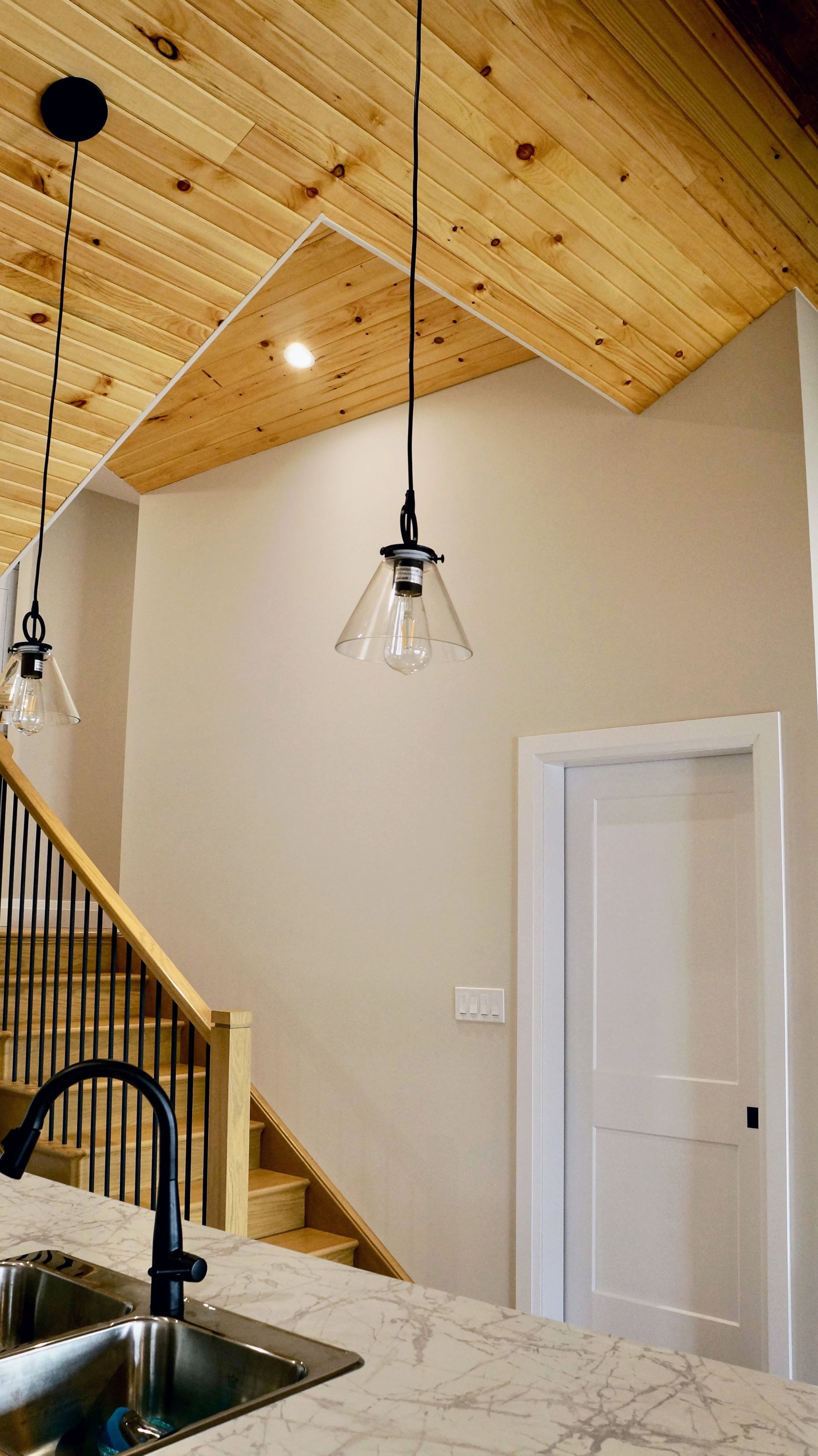 Cottage renovation staircase and pendant lights