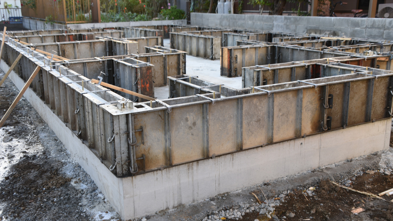 Concrete foundation framework on a construction site.