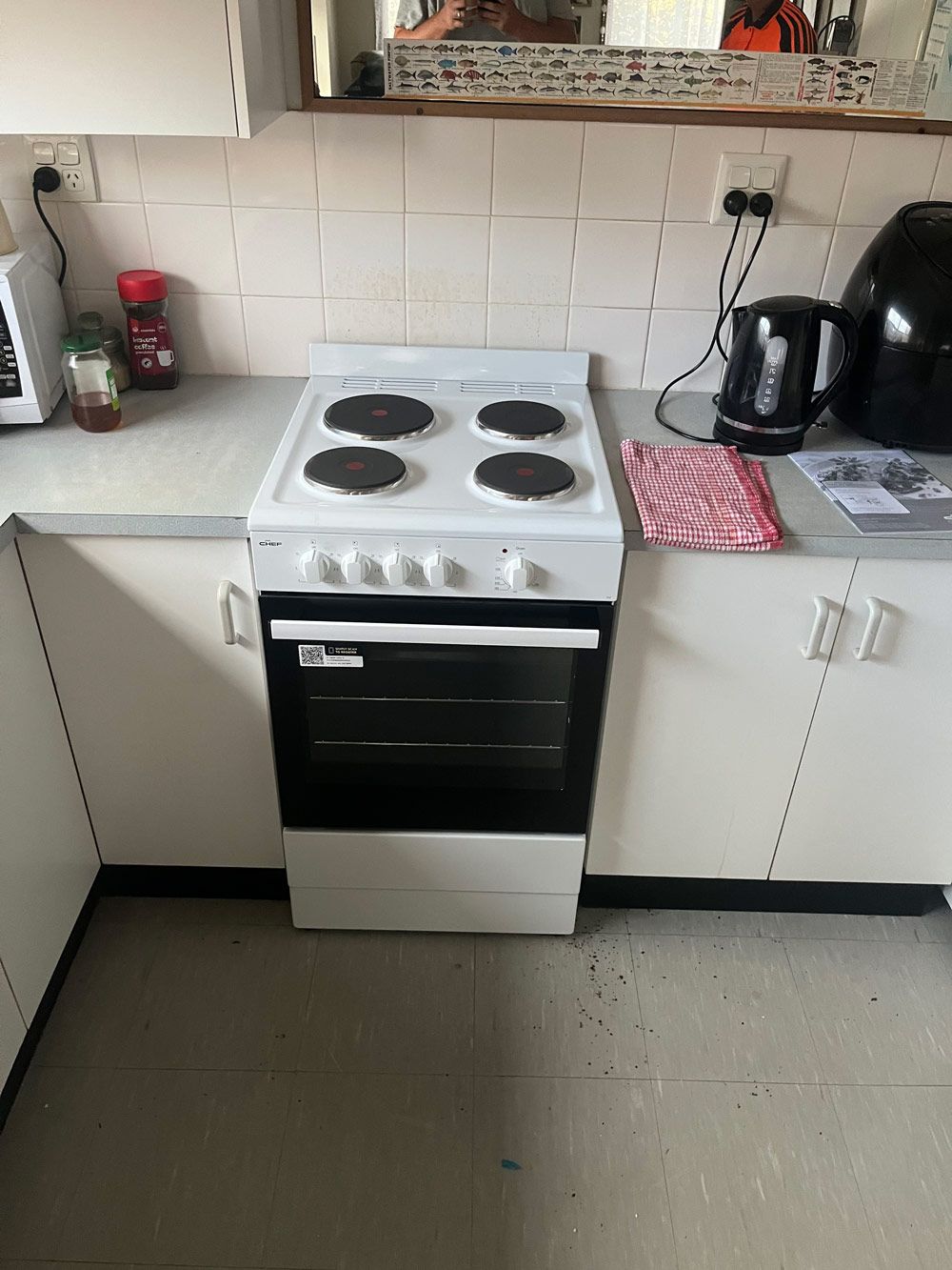 A Gas Stove with Oven — Electrician in Laurieton, NSW
