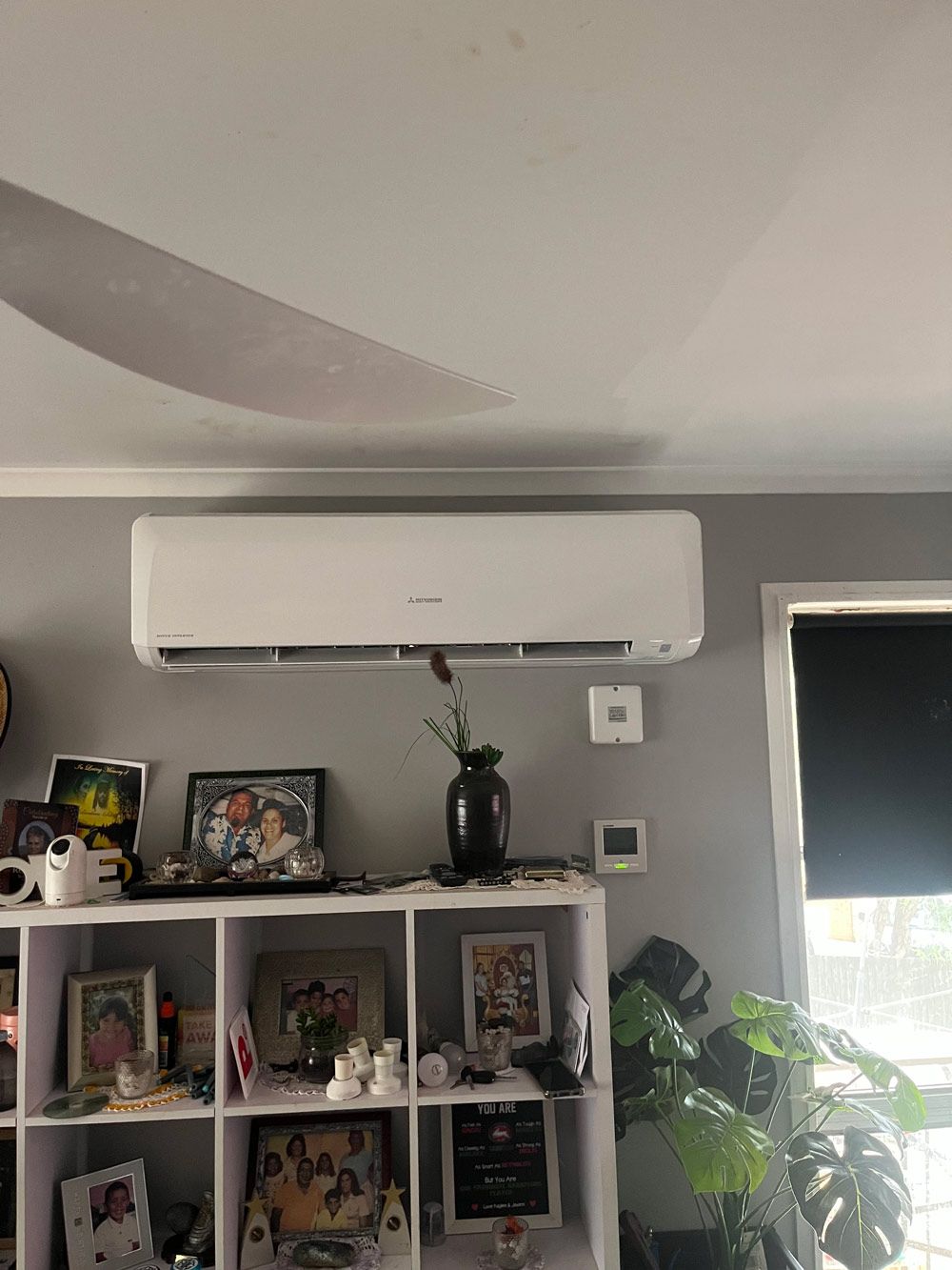 An Air-Conditioner Above the  Shelves — Electrician in Kempsey, NSW