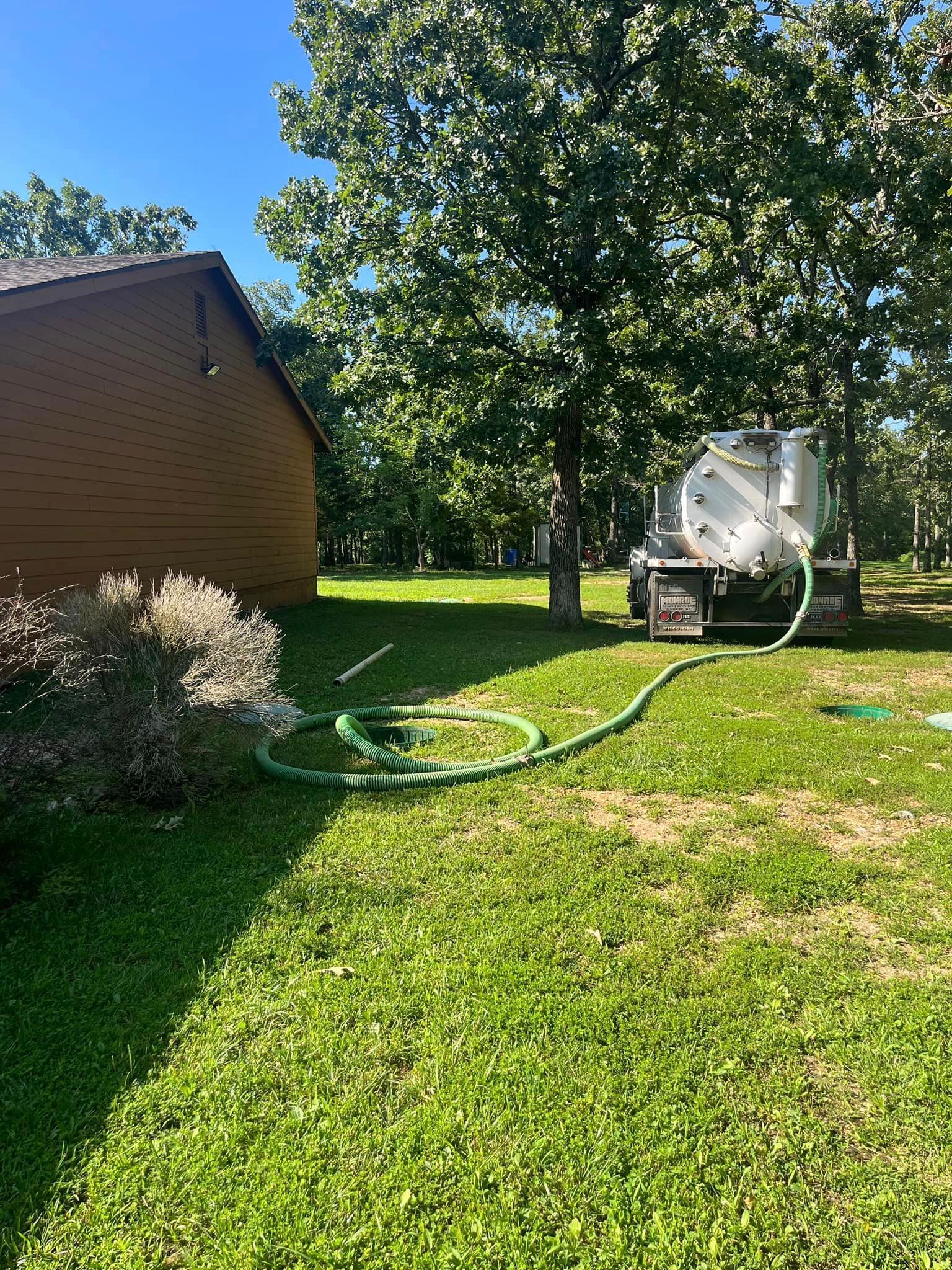 Same day emergency septic tank pumping being done at residential property near Springfield, MO