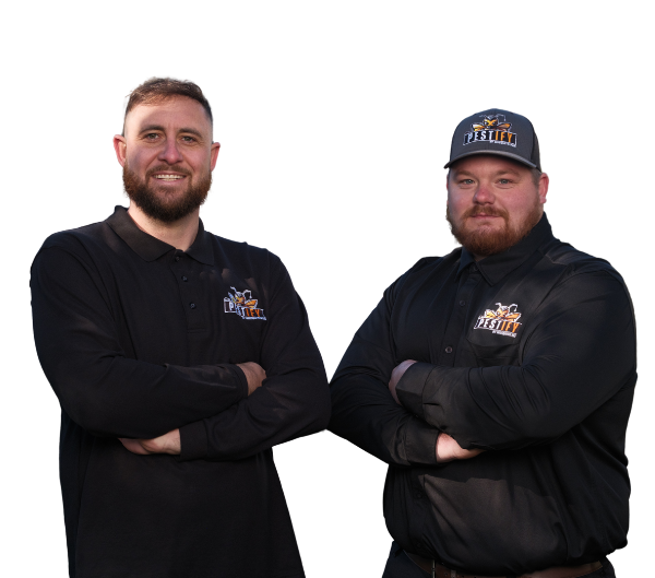 Two men in black long-sleeved polo shirts with company logos stand side-by-side with arms crossed against a white background.