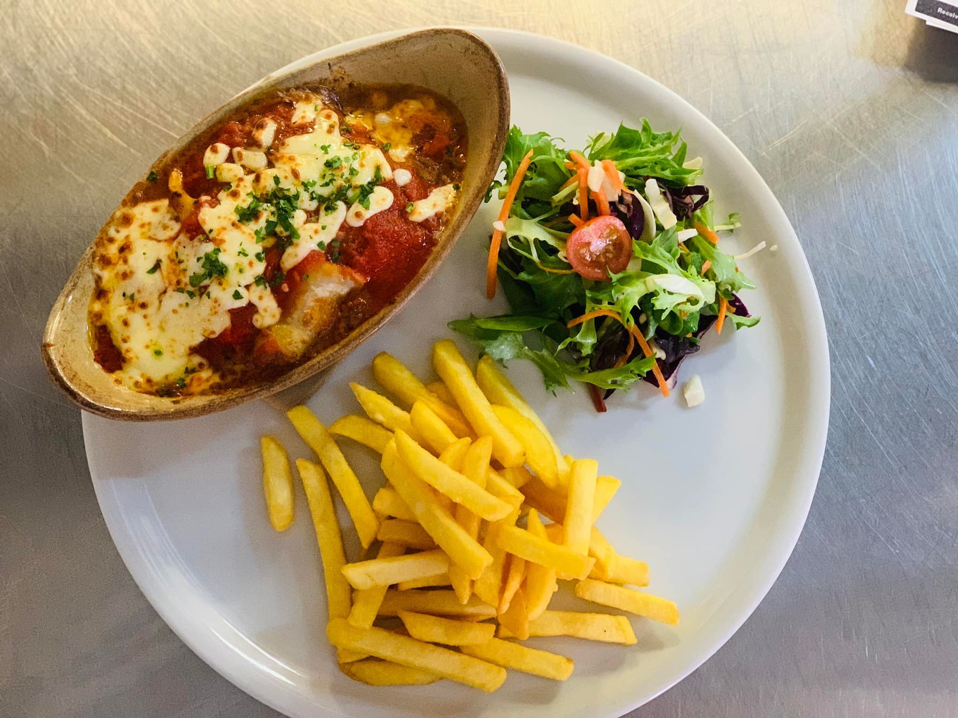 Italian lasagna with fries
