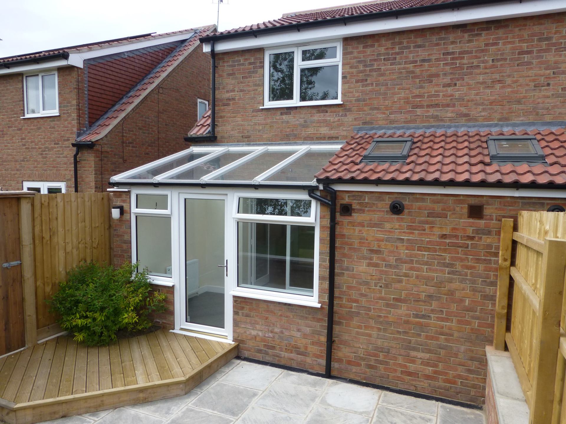 A brick house with a patio in front of it
