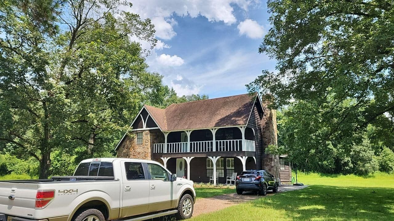 White Truck Parked In Front Of A House — Enterprise, AL — Waters Roofing LLC