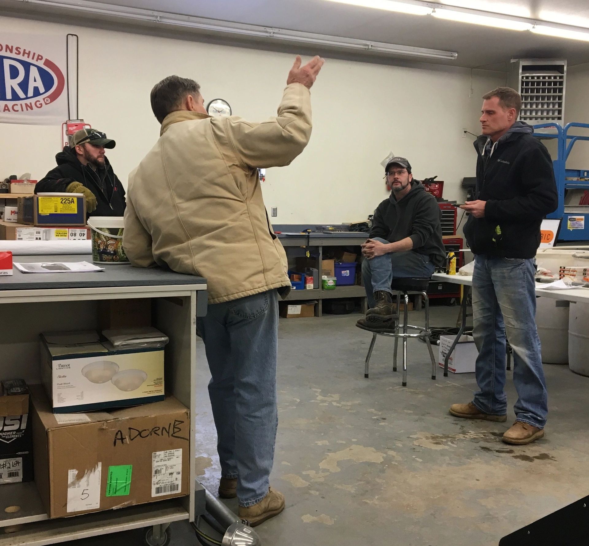 A Man in a Tan Jacket Talking to People - Aberdeen, SD - Ladner Electric