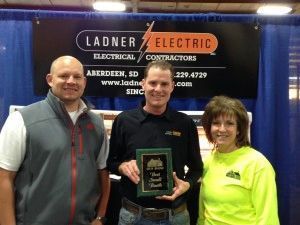 Three People with a Trophy - Aberdeen, SD - Ladner Electric