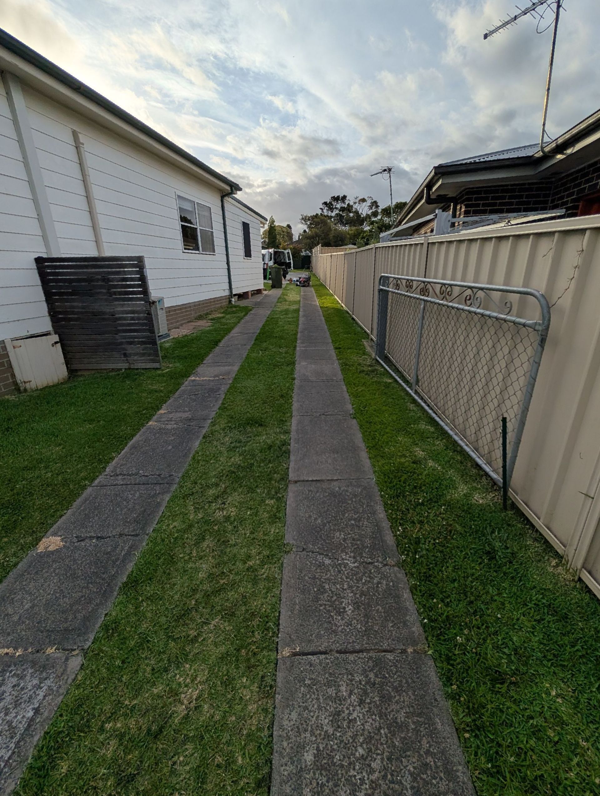 A House With A Large Porch And Stairs Leading To It — Roots, Shoots & Leaves Garden Maintenance In East Corrimal, NSW