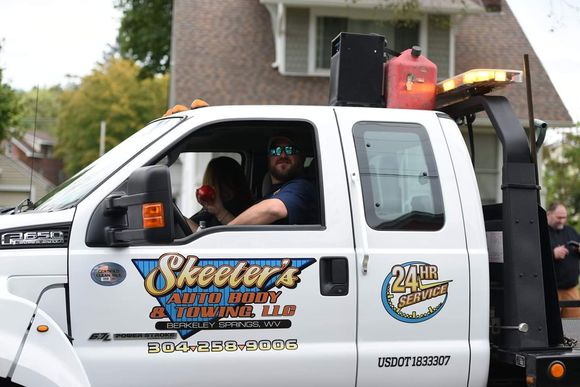 Worker Driving Towing Truck — Berkeley Springs, WV — Skeeter’s Autobody & 24-Hour Towing