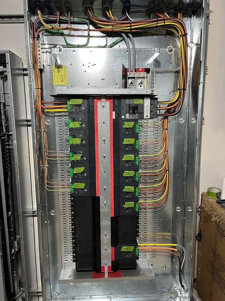 A large electrical box with a lot of wires coming out of it.