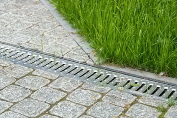 a yellow bulldozer is driving through a dirt field