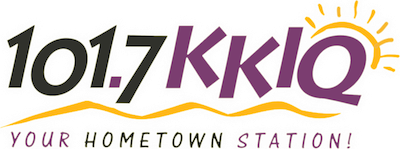 Logo for radio station 101.7 KKLQ. Purple text with sun graphic above tagline