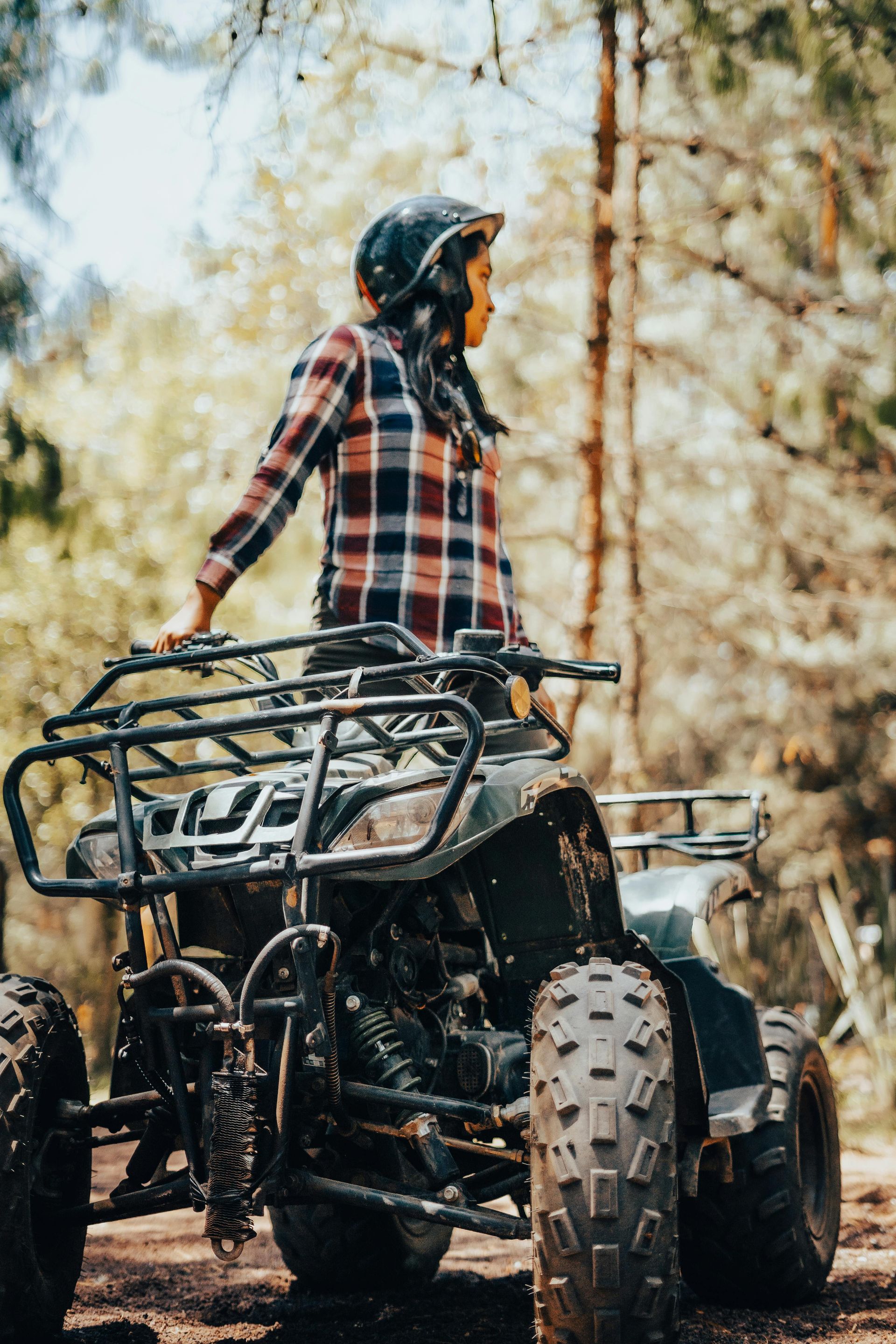 A man and a woman are looking at a clipboard.