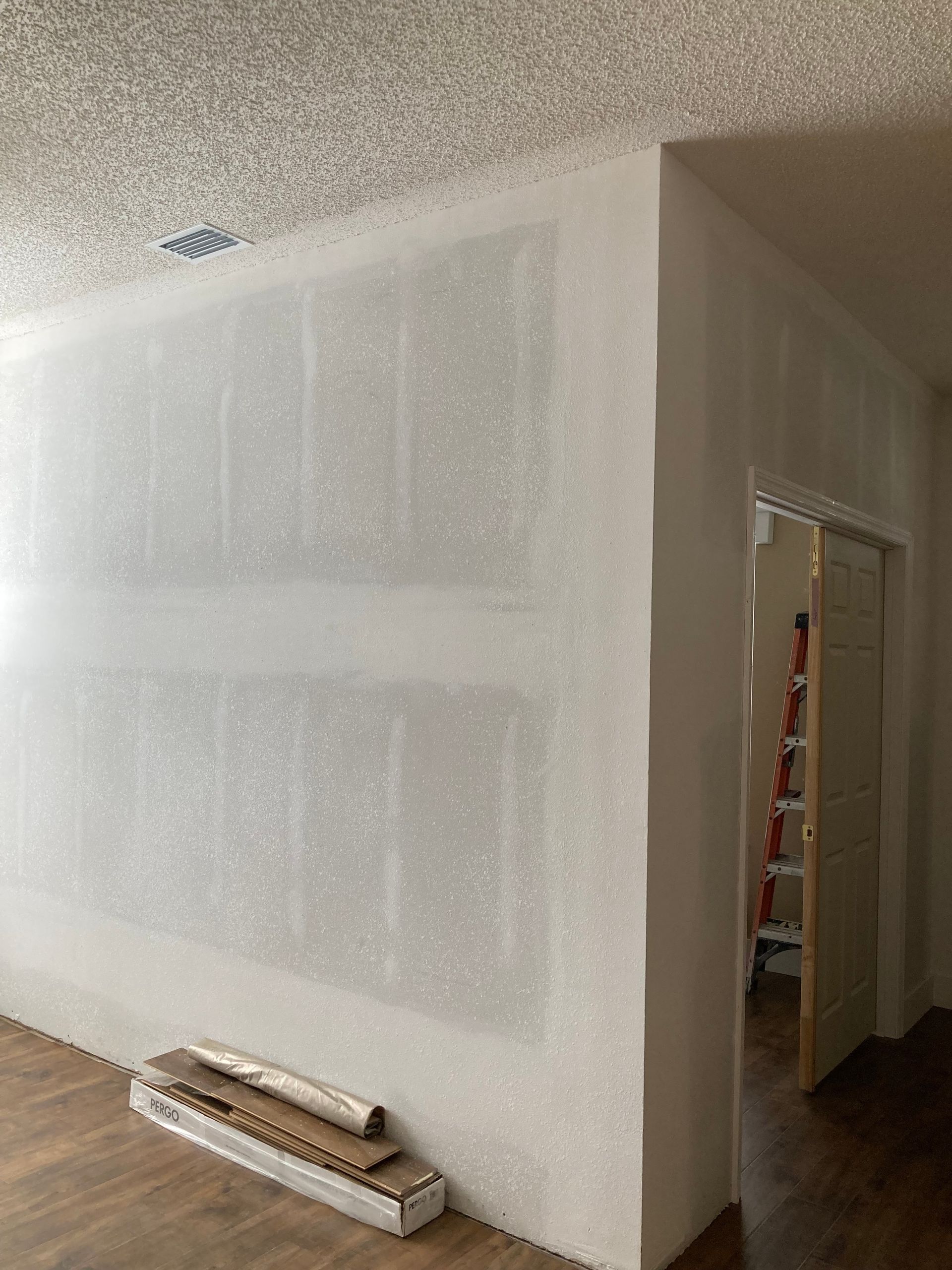 There is a ladder in the corner of the room.